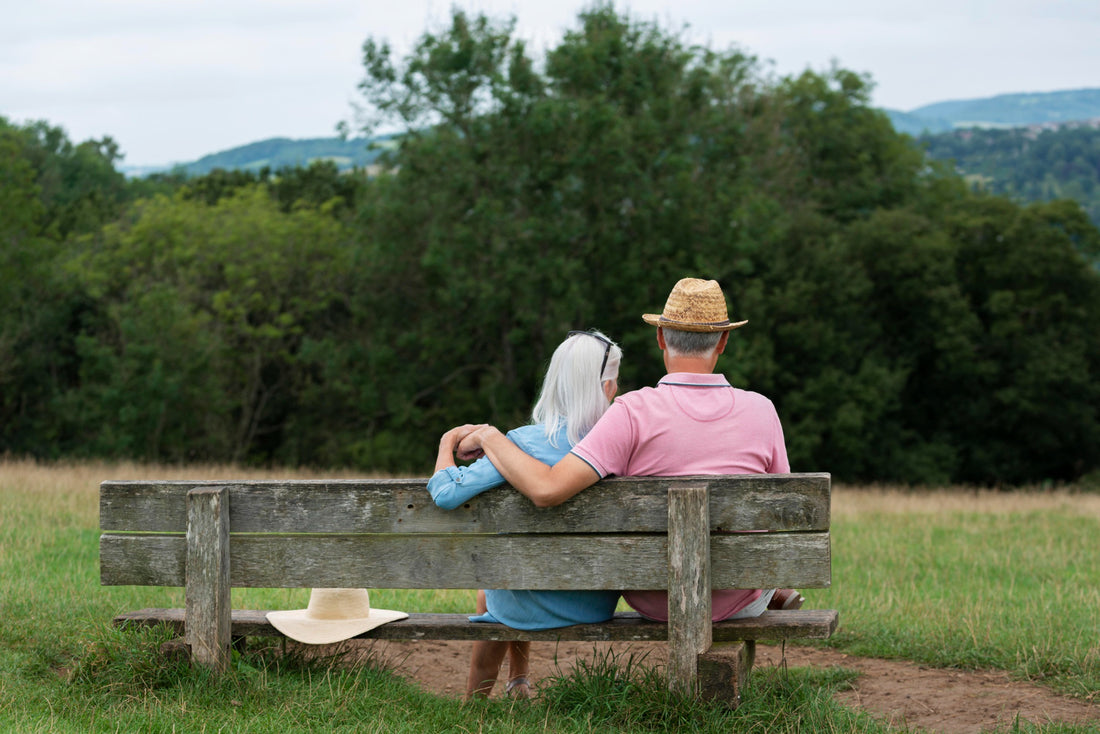 adorable senior couple sitting on a bench
