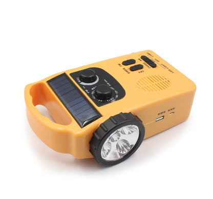 Hand-cranked radio emergency light