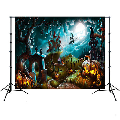 Halloween-themed backdrop with pumpkins, graves, and a haunted house under a full moon.