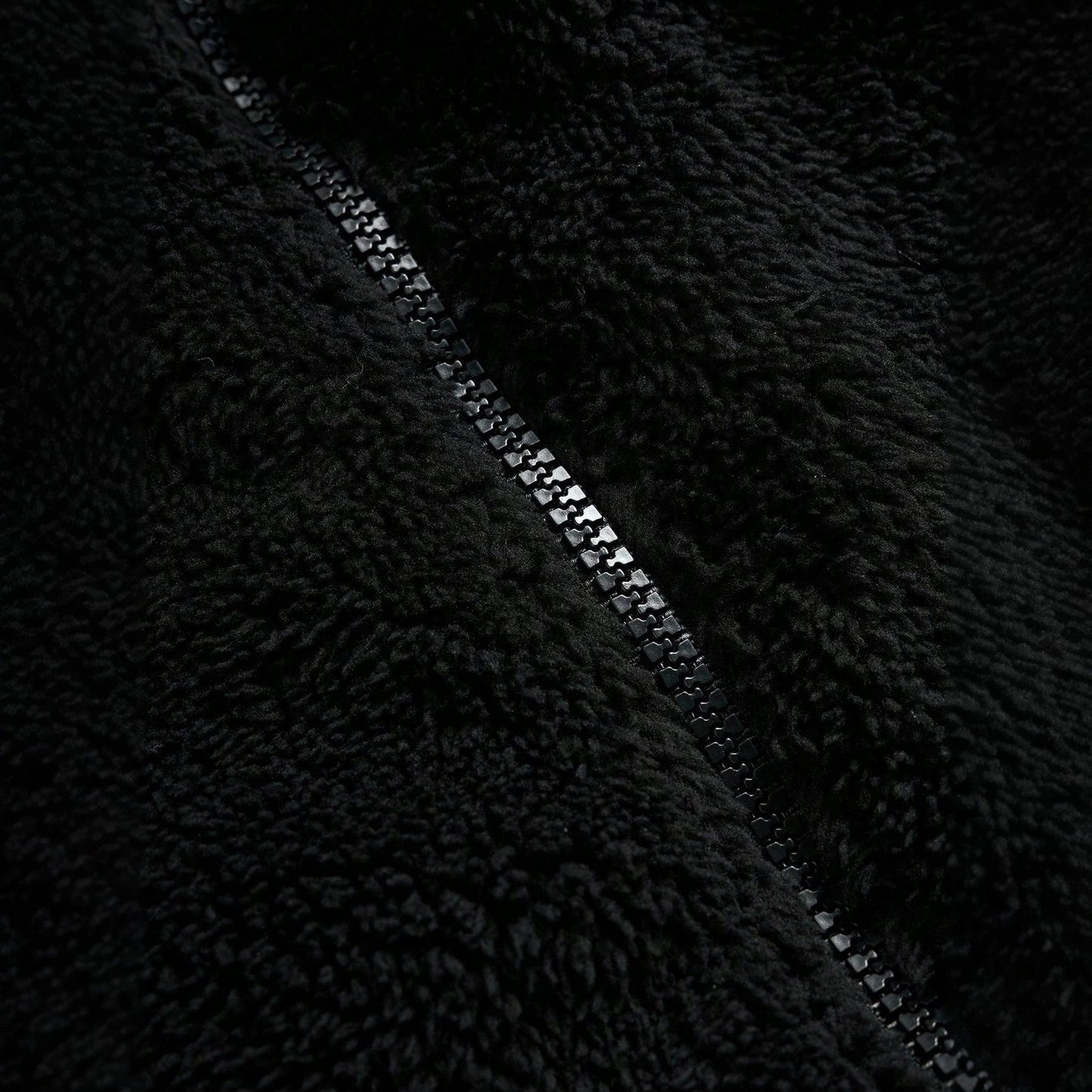 Black Furry Jacket With A Zipper And Embroidery On The Left Chest