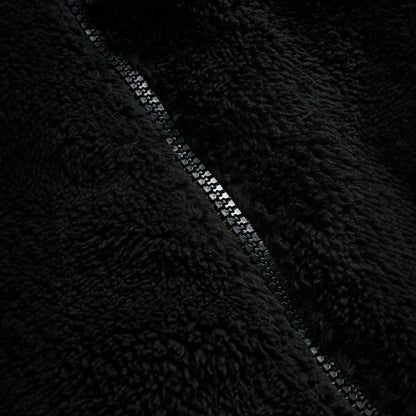 Black Furry Jacket With A Zipper And Embroidery On The Left Chest