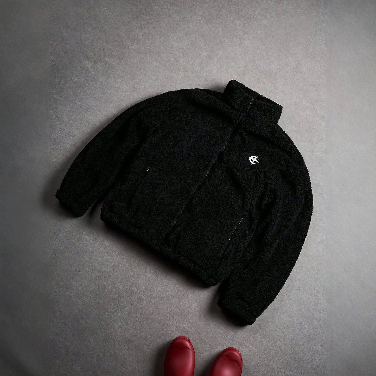 Black Furry Jacket With A Zipper And Embroidery On The Left Chest