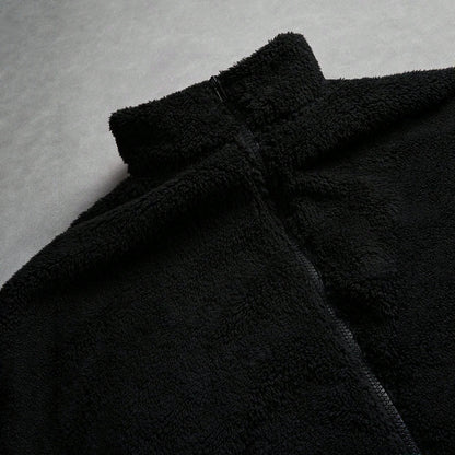 Black Furry Jacket With A Zipper And Embroidery On The Left Chest